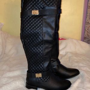 New in box. Black riding boots. Size 7.5